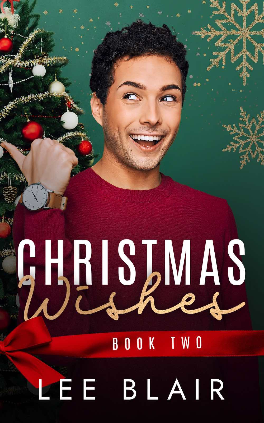 Christmas Wishes by Lee Blair. A smiling man with olive skin and dark, curly, short hair is wearing a red sweater. He's pointing over his shoulder at the half Christmas tree he's standing in front of.